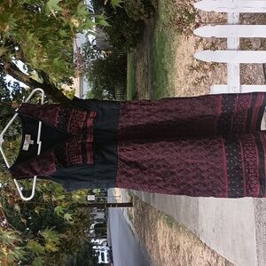 Romy size Small sleeveless black and red/magenta. Textile pattern. Zips at pit.